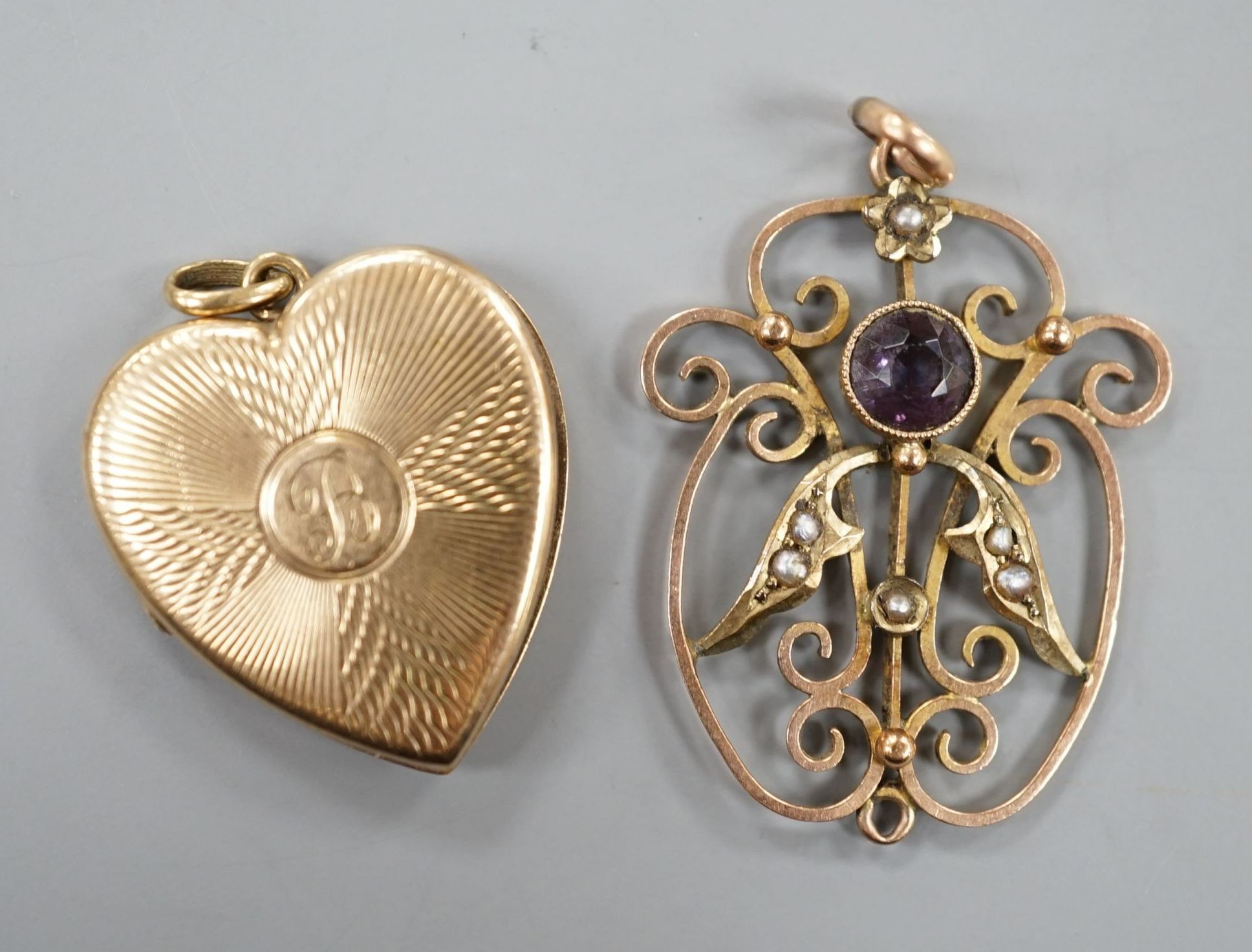 A 9ct gold heart shaped locket, with engraved inscription, 22mm and an Edwardian 9ct, amethyst and seed pearl set pendant